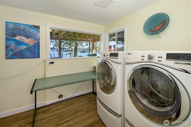 162 Sea Ranch Rd, Lopez Island, WA 98261 - laundry room featuring dark wood-style flooring, independent washer and dryer, laundry area, and baseboards