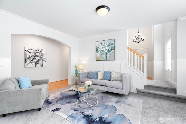 3262 NE Marquette Way, Issaquah, WA 98029 - living area with a chandelier, crown molding, stairs, and a wainscoted wall