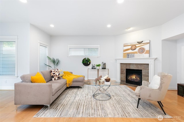 3262 NE Marquette Way, Issaquah, WA 98029 - living area with wood finished floors, a tile fireplace, recessed lighting, and baseboards