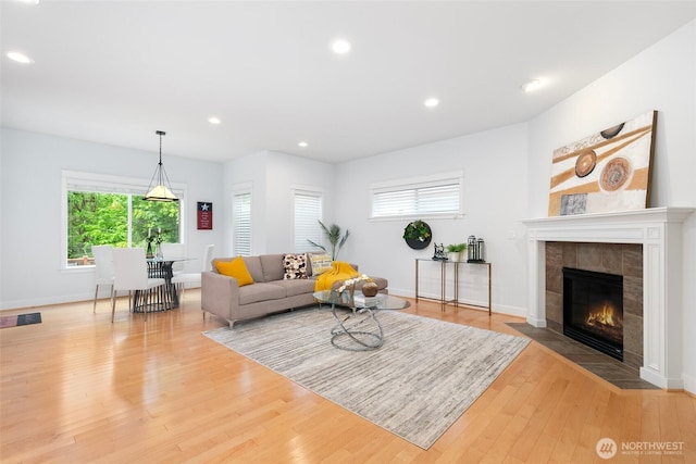 3262 NE Marquette Way, Issaquah, WA 98029 - living area featuring wood finished floors, baseboards, recessed lighting, and a tile fireplace