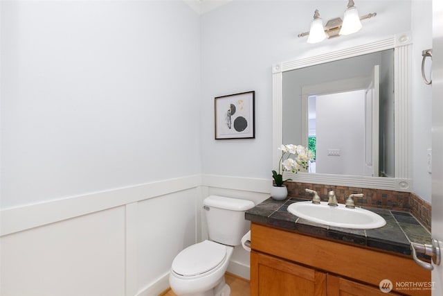 3262 NE Marquette Way, Issaquah, WA 98029 - half bathroom with vanity, toilet, and a wainscoted wall