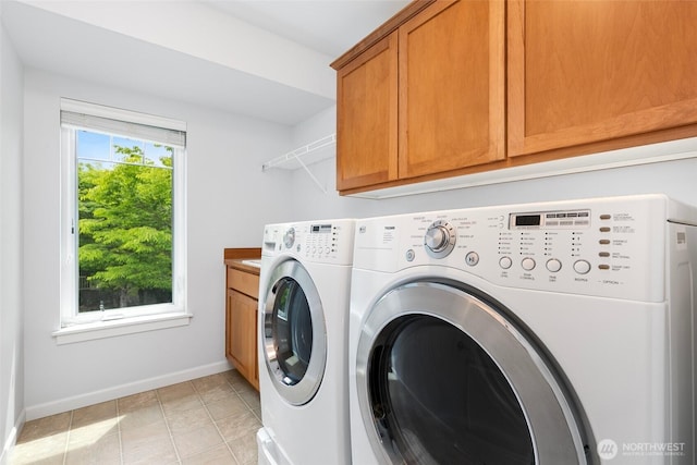 3262 NE Marquette Way, Issaquah, WA 98029 - laundry area with washing machine and dryer, cabinet space, baseboards, and light tile patterned floors