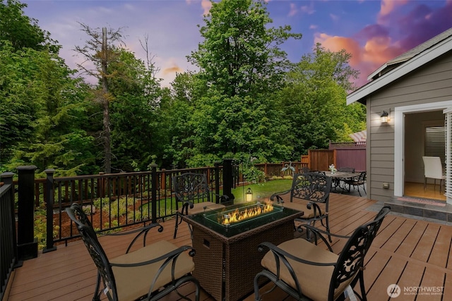 3262 NE Marquette Way, Issaquah, WA 98029 - deck at dusk with an outdoor fire pit and outdoor dining space