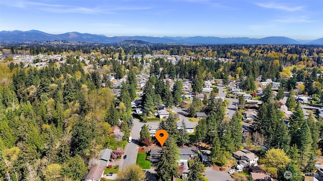 bird's eye view with a residential view, a wooded view, and a mountain view