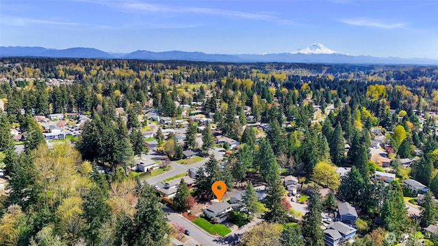 bird's eye view with a residential view, a view of trees, and a mountain view