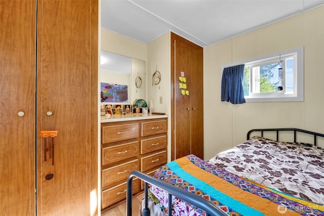 bedroom featuring wood finished floors and a closet