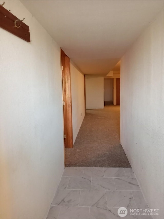 corridor featuring light carpet