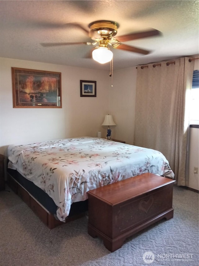carpeted bedroom featuring a ceiling fan