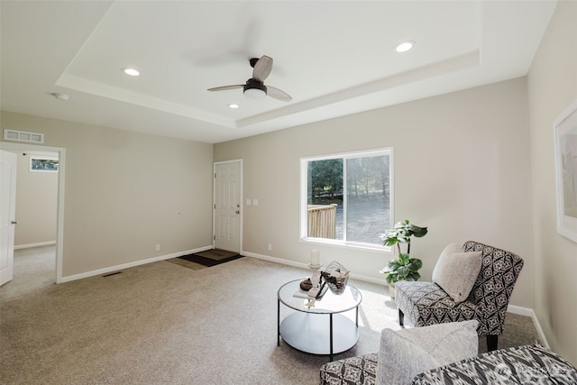 18142 NE Diamond Rd, Poulsbo, WA 98370 - sitting room featuring carpet flooring, visible vents, a tray ceiling, and ceiling fan