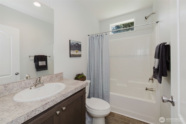 18142 NE Diamond Rd, Poulsbo, WA 98370 - bathroom featuring toilet, shower / bath combo with shower curtain, vanity, and wood finished floors