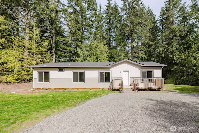 18142 NE Diamond Rd, Poulsbo, WA 98370 - view of front of home featuring a wooden deck, crawl space, a front lawn, and gravel driveway