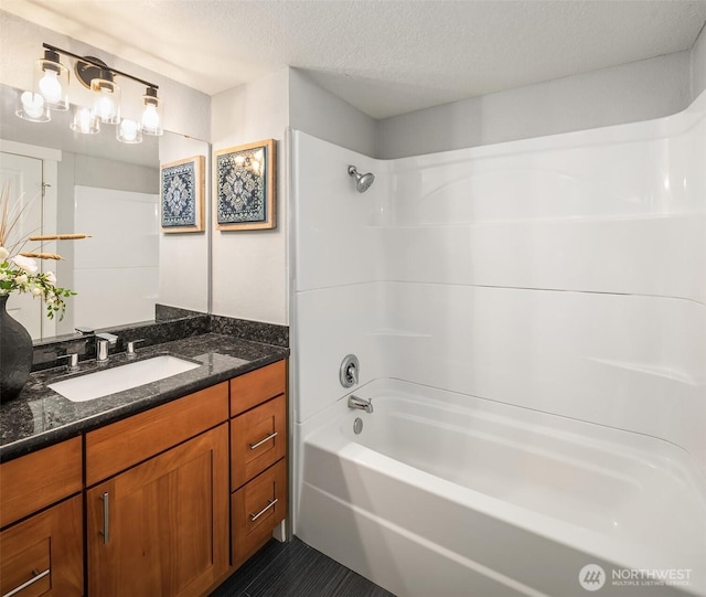 11634 100th Ave NE Unit 323, Kirkland, WA 98034 - bathroom featuring vanity, shower / bath combination, a textured ceiling, and tile patterned floors