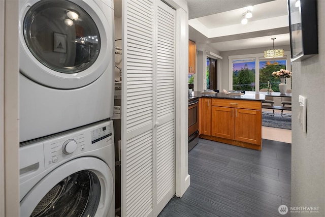 11634 100th Ave NE Unit 323, Kirkland, WA 98034 - clothes washing area featuring stacked washer / drying machine