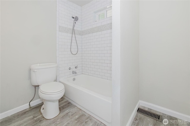 3335 Trenton Ave NE, Bremerton, WA 98310 - full bathroom with toilet, baseboards, wood finished floors, and bathing tub / shower combination