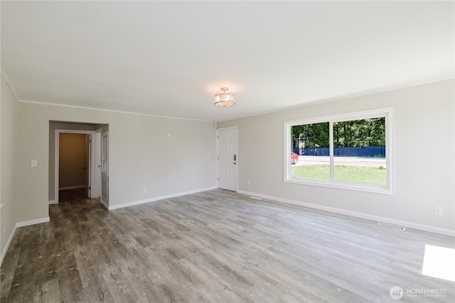 3335 Trenton Ave NE, Bremerton, WA 98310 - spare room with wood finished floors, baseboards, and crown molding
