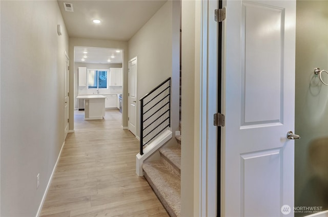 18218 37th Ave E, Tacoma, WA 98446 - hall featuring light wood-type flooring, baseboards, recessed lighting, stairway, and visible vents