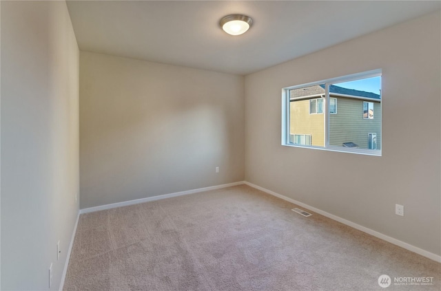 18218 37th Ave E, Tacoma, WA 98446 - unfurnished room with carpet floors, baseboards, and visible vents