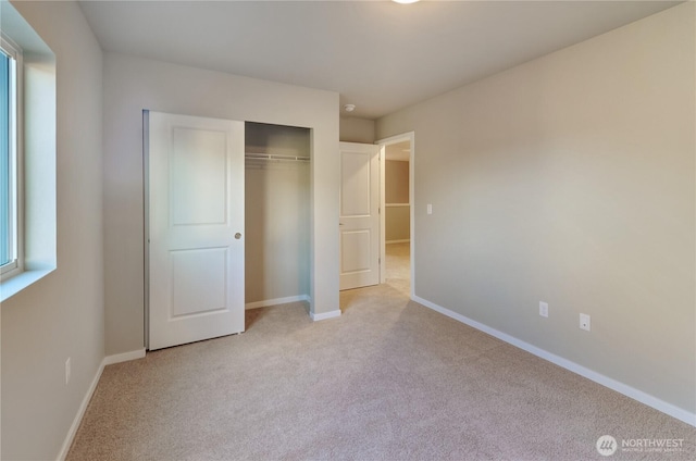 18218 37th Ave E, Tacoma, WA 98446 - unfurnished bedroom with light carpet, a closet, and baseboards