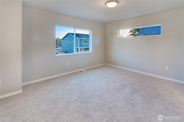18218 37th Ave E, Tacoma, WA 98446 - carpeted empty room featuring visible vents and baseboards