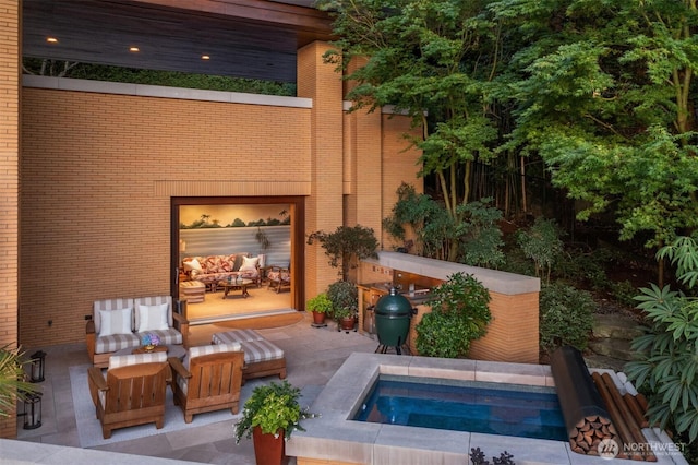 exterior space with a patio and an outdoor hangout area