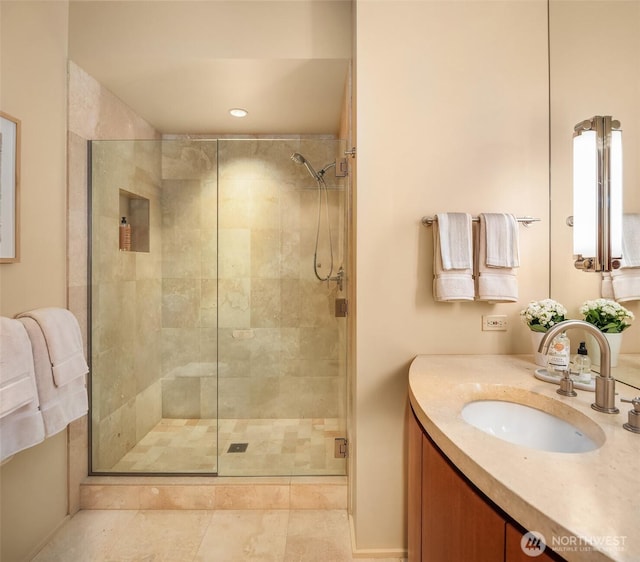 full bathroom with recessed lighting, a stall shower, and vanity