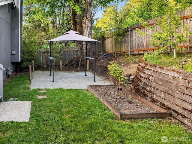 view of yard featuring a gazebo and a patio area