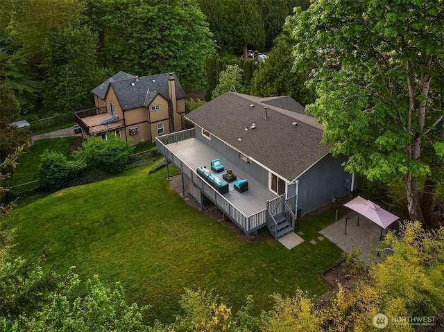 view of subject property featuring a heavily wooded area