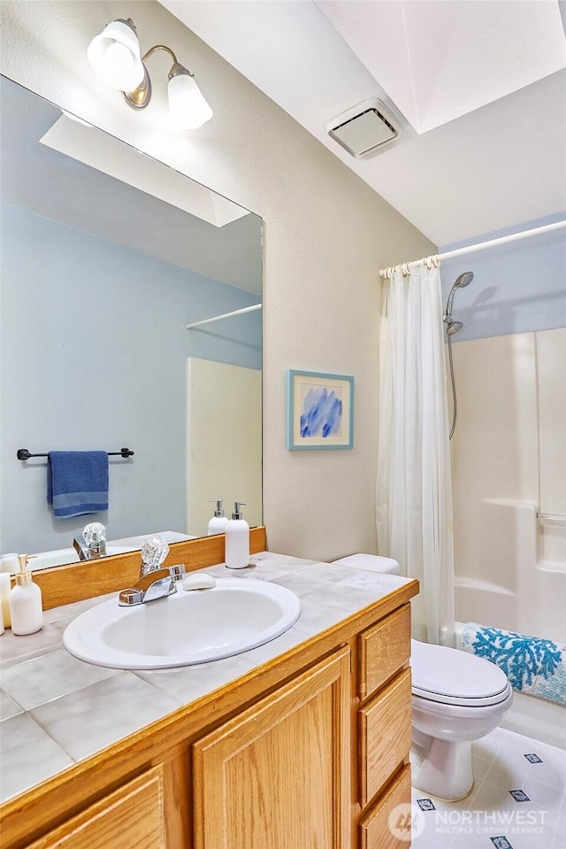 21850 SE 271st Pl, Maple Valley, WA 98038 - full bathroom featuring visible vents, toilet, shower / bathtub combination with curtain, vanity, and tile patterned flooring