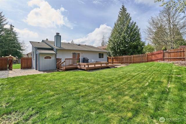 21850 SE 271st Pl, Maple Valley, WA 98038 - back of house featuring a patio, a chimney, a fenced backyard, and a lawn