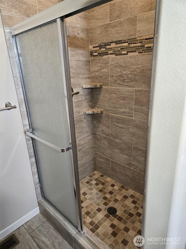 full bath featuring visible vents and a stall shower