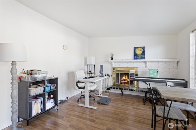 14043 Burke Ave N, Seattle, WA 98133 - office featuring a fireplace, baseboards, and wood finished floors