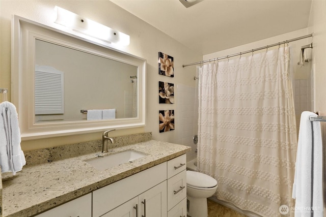 full bathroom featuring vanity, shower / bath combination with curtain, and toilet