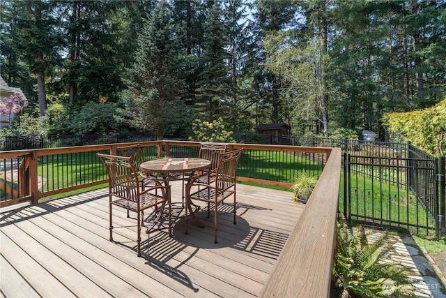 wooden deck featuring outdoor dining space