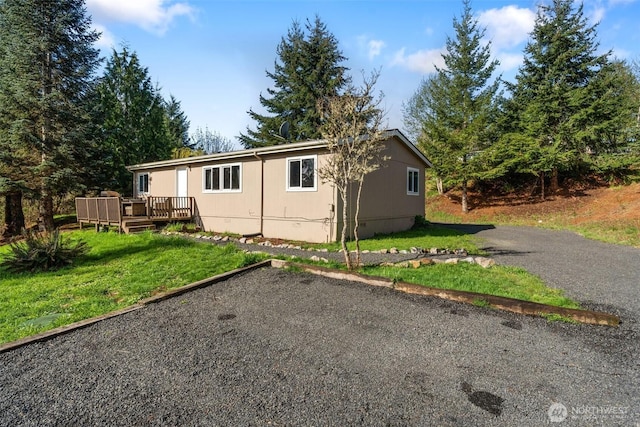 151 Deer Haven Dr, Winlock, WA 98596 - exterior space with a front lawn and a deck