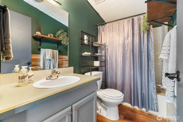 151 Deer Haven Dr, Winlock, WA 98596 - full bath featuring wood finished floors, shower / tub combo, toilet, and vanity