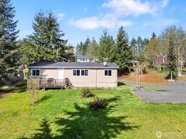 151 Deer Haven Dr, Winlock, WA 98596 - view of front of house with a wooden deck and a front yard