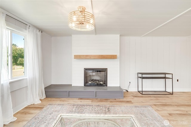 1401 264th Pl, Ocean Park, WA 98640 - unfurnished living room with a large fireplace and wood finished floors