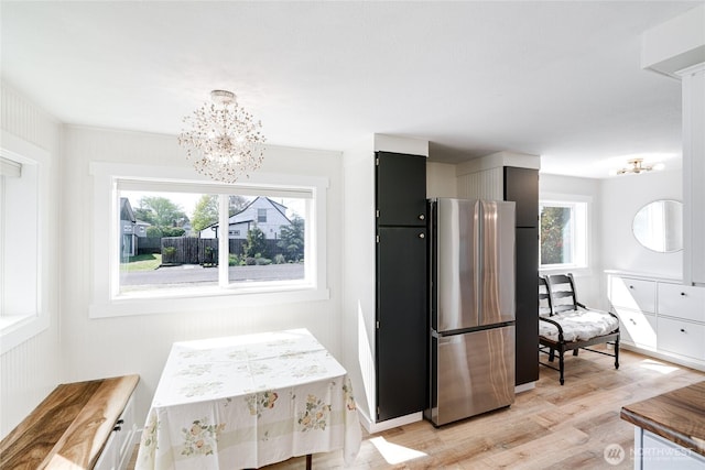 1401 264th Pl, Ocean Park, WA 98640 - dining area with light wood-style floors and an inviting chandelier