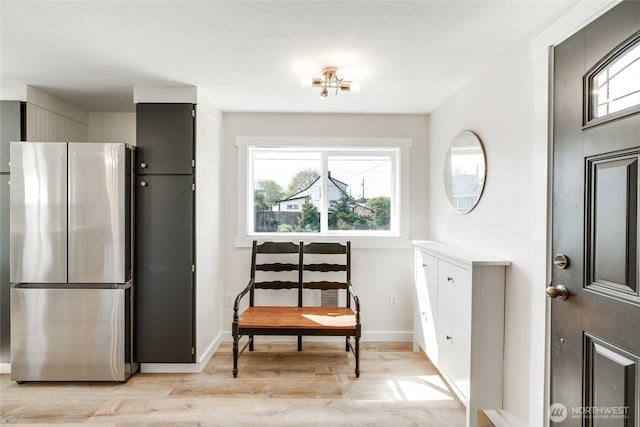 1401 264th Pl, Ocean Park, WA 98640 - sitting room with light wood-style floors and baseboards