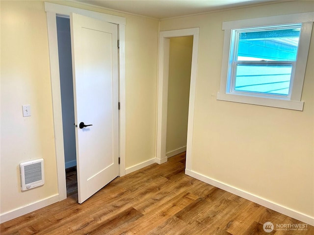 1401 264th Pl, Ocean Park, WA 98640 - spare room featuring baseboards, heating unit, and wood finished floors