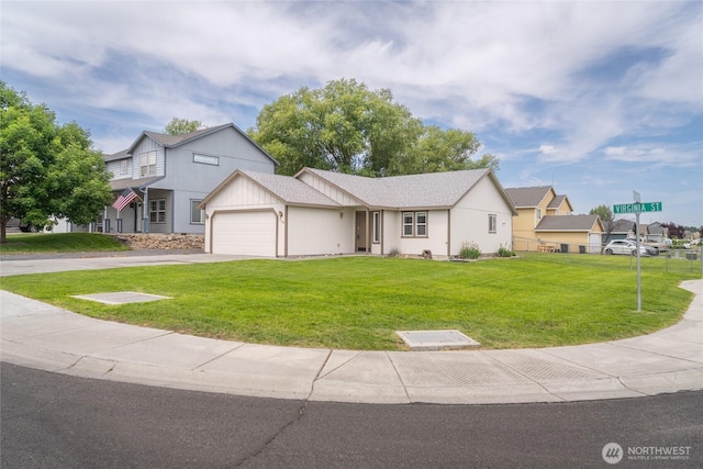 1310 W Virginia St, Moses Lake, WA 98837 - view of front of house featuring a front yard, an attached garage, and driveway