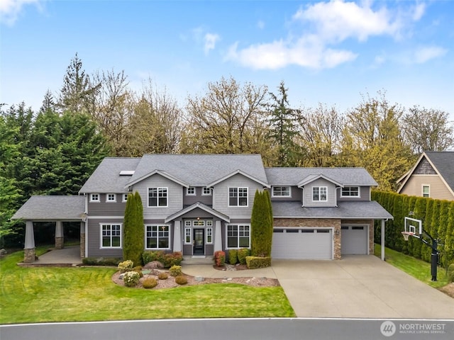 107 Nicola Ct, Chehalis, WA 98532 - traditional-style home featuring concrete driveway, an attached garage, stone siding, and a front lawn