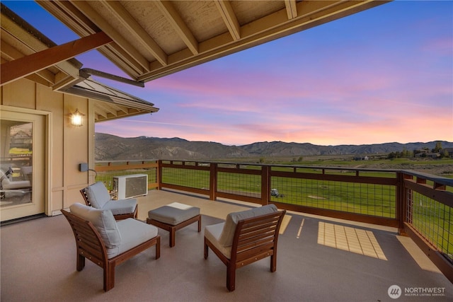 view of patio / terrace featuring a mountain view