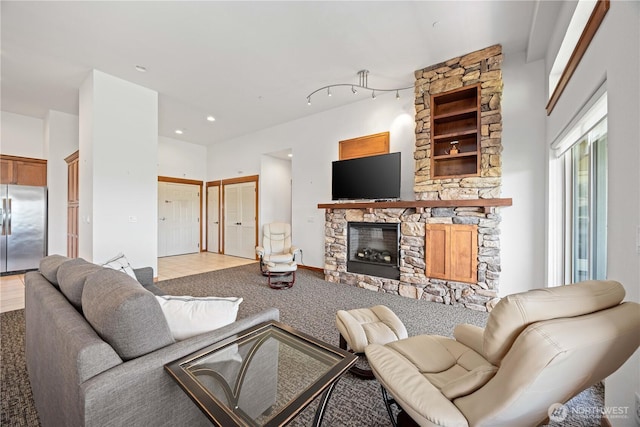 living area with a fireplace and recessed lighting