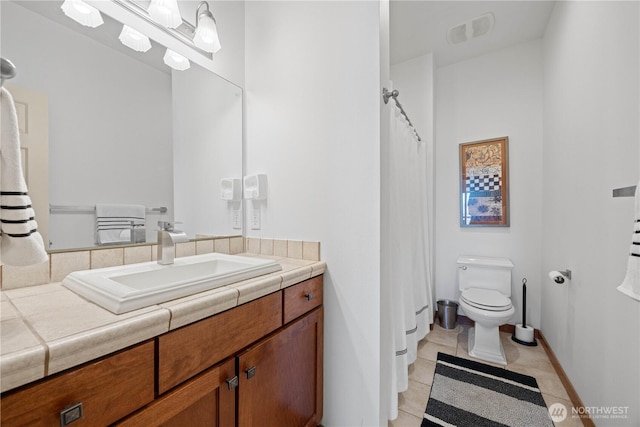 full bathroom featuring tile patterned floors, vanity, baseboards, toilet, and visible vents