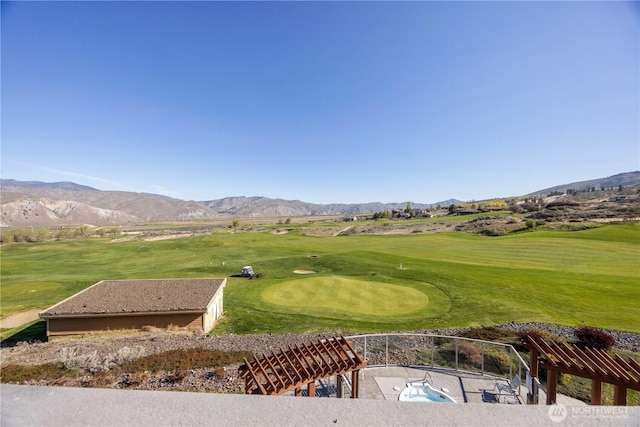 exterior space featuring a mountain view and golf course view
