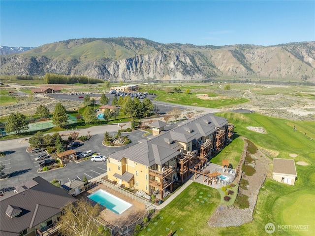birds eye view of property featuring a mountain view and golf course view