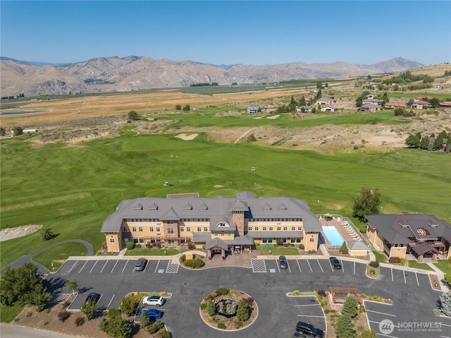birds eye view of property featuring a mountain view and golf course view