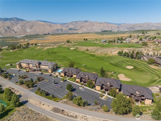 bird's eye view with view of golf course, a residential view, and a mountain view