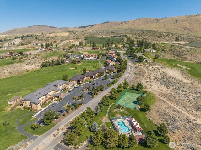bird's eye view featuring a mountain view and golf course view